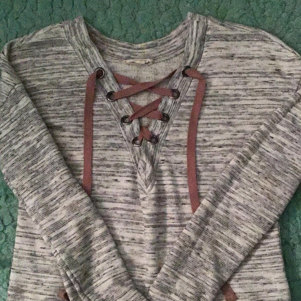 Grey long sleeve cross string